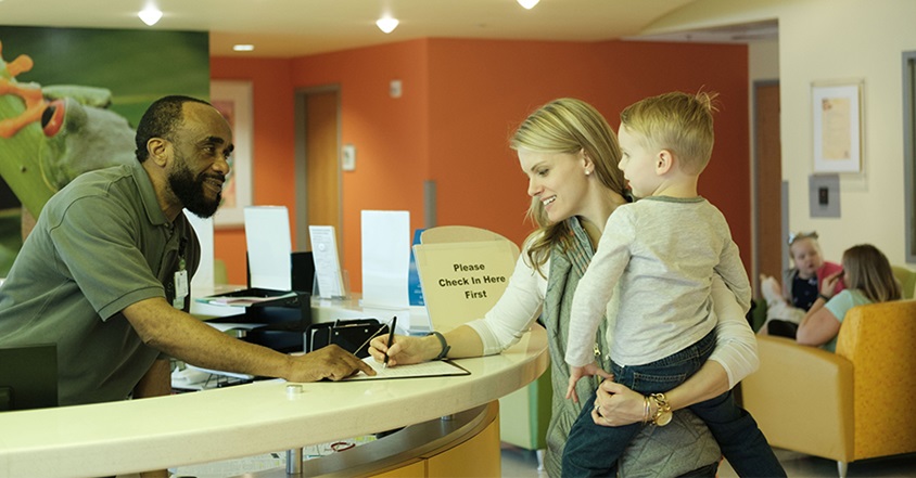 Mother and son checking in for flu care