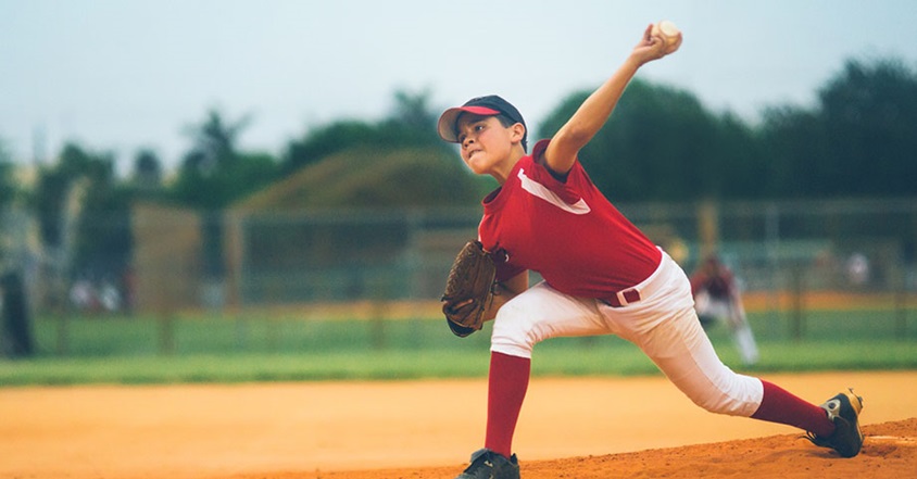 Boy pitching from baseball mound