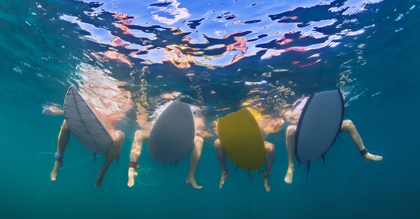 Kids sitting on surfboards in the ocean
