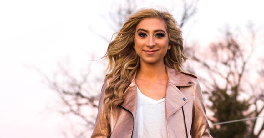 Scoliosis patient Madison Parks smiling in a park